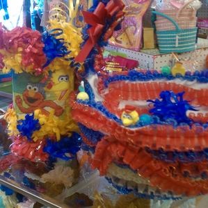 Handmade small pinatas with baskets for favors